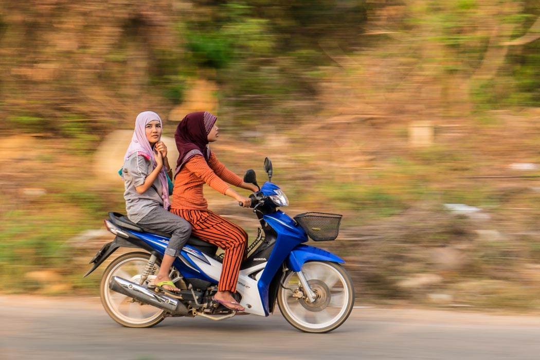 Two young girls on a scooter in Koh Lanta. things to do in koh lanta