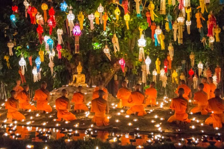 Buddhist monks praying for the Loy Krathong festival in Chiang Mai, Thailand.